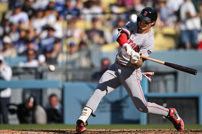 Jul 21, 2024; Los Angeles, California, USA; Boston Red Sox outfielder Jarren Duran (16) hits into a force out at first base against the Los Angeles Dodgers during the fifth inning at Dodger Stadium. Mandatory Credit: Jonathan Hui-USA TODAY Sports