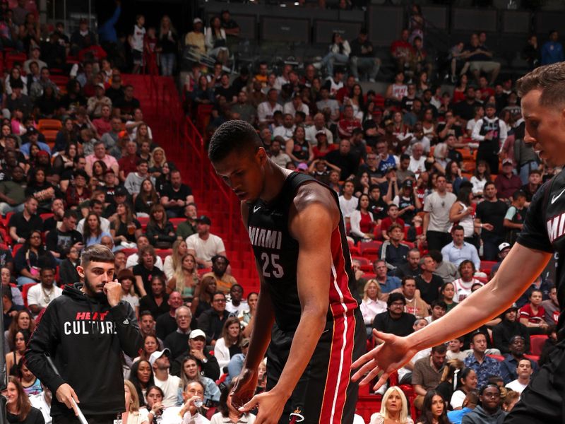 MIAMI, FL - MARCH 2: Terry Rozier III #2 of the Miami Heat is helped up by teammates during the game against the Utah Jazz on March 2, 2024 at Kaseya Center in Miami, Florida. NOTE TO USER: User expressly acknowledges and agrees that, by downloading and or using this Photograph, user is consenting to the terms and conditions of the Getty Images License Agreement. Mandatory Copyright Notice: Copyright 2024 NBAE (Photo by Issac Baldizon/NBAE via Getty Images)