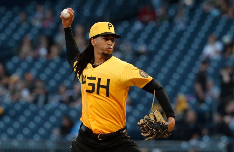 Sep 29, 2023; Pittsburgh, Pennsylvania, USA;  Pittsburgh Pirates starting pitcher Osvaldo Bido (70) delivers a pitch against the Miami Marlins during the first inning at PNC Park. Mandatory Credit: Charles LeClaire-USA TODAY Sports