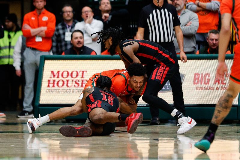 Jan 19, 2024; Fort Collins, Colorado, USA; Colorado State Rams guard Josiah Strong (3) battles for the ball with UNLV Rebels guard Luis Rodriguez (15) and forward Keylan Boone (20) in the first half at Moby Arena. Mandatory Credit: Isaiah J. Downing-USA TODAY Sports