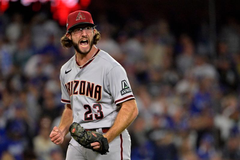 Oct 9, 2023; Los Angeles, California, USA; Arizona Diamondbacks starting pitcher Zac Gallen (23) reacts after an out against the Los Angeles Dodgers during the fifth inning for game two of the NLDS for the 2023 MLB playoffs at Dodger Stadium. Mandatory Credit: Jayne Kamin-Oncea-USA TODAY Sports