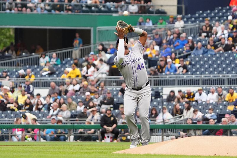 May 4, 2024; Pittsburgh, Pennsylvania, USA; Colorado Rockies first baseman Elehuris Montero (44) catches a fly ball hit by Pittsburgh Pirates third baseman Ke'Bryan Hayes (not pictured) during the first inning at PNC Park. Mandatory Credit: Gregory Fisher-USA TODAY Sports