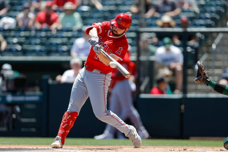 May 22, 2025; West Sacramento, California, USA; Los Angeles Angels first baseman Nolan Schanuel (18) hits a single during the first inning against the Athletics at Sutter Health Park. Mandatory Credit: Sergio Estrada-Imagn Images