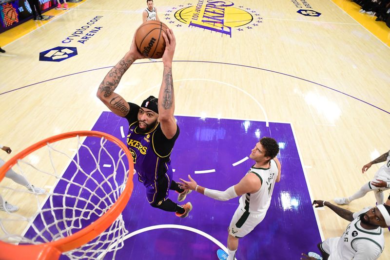 LOS ANGELES, CA - MARCH 8: Anthony Davis #3 of the Los Angeles Lakers dunks the ball during the game against the Milwaukee Bucks on March 8, 2024 at Crypto.Com Arena in Los Angeles, California. NOTE TO USER: User expressly acknowledges and agrees that, by downloading and/or using this Photograph, user is consenting to the terms and conditions of the Getty Images License Agreement. Mandatory Copyright Notice: Copyright 2024 NBAE (Photo by Adam Pantozzi/NBAE via Getty Images)