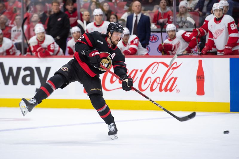 Dec 5, 2024; Ottawa, Ontario, CAN;  Ottawa Senators defenseman Thomas Chabot (72) shoots the puck in the first period against the Detroit Red Wings at the Canadian Tire Centre. Mandatory Credit: Marc DesRosiers-Imagn Images