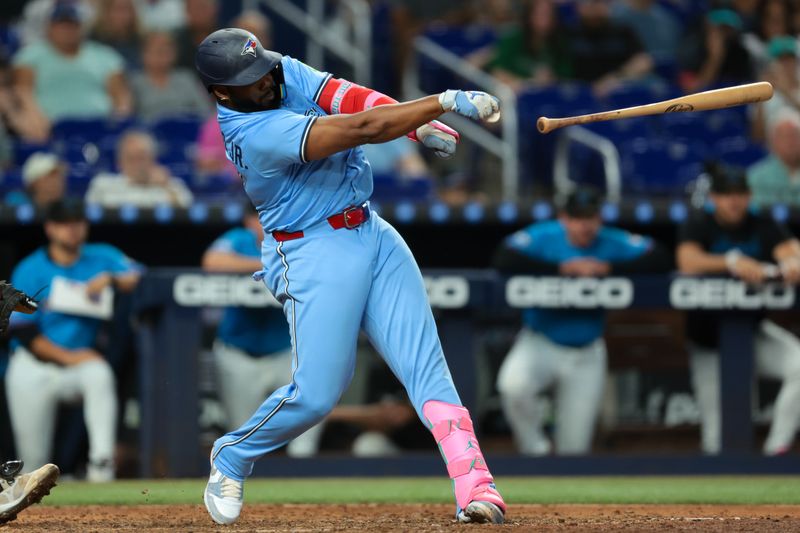 Aug 24, 2025; Miami, Florida, USA; Toronto Blue Jays first baseman Vladimir Guerrero Jr. (27) drops his bat against the Miami Marlins during the eighth inning at loanDepot Park. Mandatory Credit: Sam Navarro-Imagn Images Aug 24, 2025; Miami, Florida, USA; Toronto Blue Jays first baseman Vladimir Guerrero Jr. (27) drops his bat against the Miami Marlins during the eighth inning at loanDepot Park. Mandatory Credit: Sam Navarro-Imagn Images