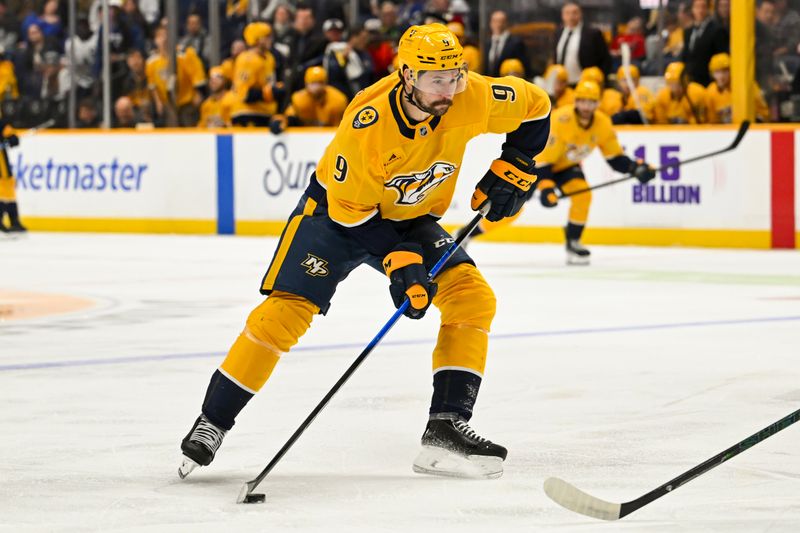 Dec 20, 2025; Nashville, Tennessee, USA;  Nashville Predators left wing Filip Forsberg (9) skates with the puck against the Toronto Maple Leafs during the first period at Bridgestone Arena. Mandatory Credit: Steve Roberts-Imagn Images