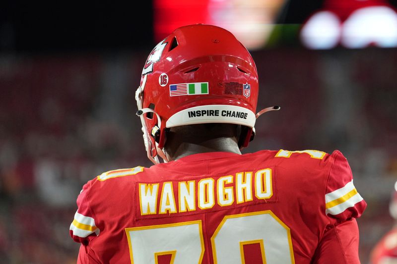 Kansas City Chiefs offensive tackle Prince Tega Wanogho (70) wears a Nigeria glad net to the USA flag on his helmet during an NFL football game against the touchback, Sunday, October 2, 2022 in Tampa, FL. The Chiefs defeat the Buccaneers 41-31. (Peter Joneleit via AP)