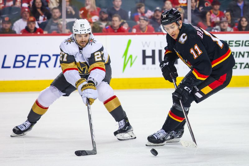 Mar 14, 2024; Calgary, Alberta, CAN; Calgary Flames center Mikael Backlund (11) and Vegas Golden Knights defenseman Shea Theodore (27) battles for the puck during the second period at Scotiabank Saddledome. Mandatory Credit: Sergei Belski-USA TODAY Sports