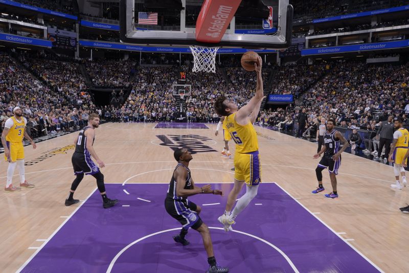 SACRAMENTO, CA - MARCH 13:  Austin Reaves #15 of the Los Angeles Lakers drives to the basket during the game against the Sacramento Kings on March 13, 2024 at Golden 1 Center in Sacramento, California. NOTE TO USER: User expressly acknowledges and agrees that, by downloading and or using this Photograph, user is consenting to the terms and conditions of the Getty Images License Agreement. Mandatory Copyright Notice: Copyright 2024 NBAE (Photo by Rocky Widner/NBAE via Getty Images)