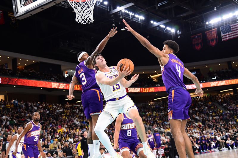 LOS ANGELES, CA - OCTOBER 6: Austin Reaves #15 of the Los Angeles Lakers drives to the basket during the game against the Phoenix Suns on October 6, 2024 at Acrisure Arena in Palm Springs, California. NOTE TO USER: User expressly acknowledges and agrees that, by downloading and/or using this Photograph, user is consenting to the terms and conditions of the Getty Images License Agreement. Mandatory Copyright Notice: Copyright 2024 NBAE (Photo by Adam Pantozzi/NBAE via Getty Images)