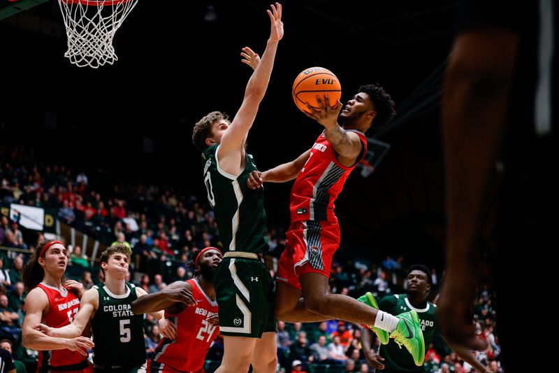 Mar 3, 2023; Fort Collins, Colorado, USA; New Mexico Lobos guard Donovan Dent (2) drives to the net against Colorado State Rams forward James Moors (10) in the first half at Moby Arena. Mandatory Credit: Isaiah J. Downing-USA TODAY Sports