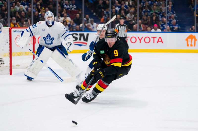 Jan 20, 2024; Vancouver, British Columbia, CAN; Vancouver Canucks forward J.T. Miller (9) skates after the loose puck against the Toronto Maple Leafs in the third period at Rogers Arena. Canucks won 6-4. Mandatory Credit: Bob Frid-USA TODAY Sports