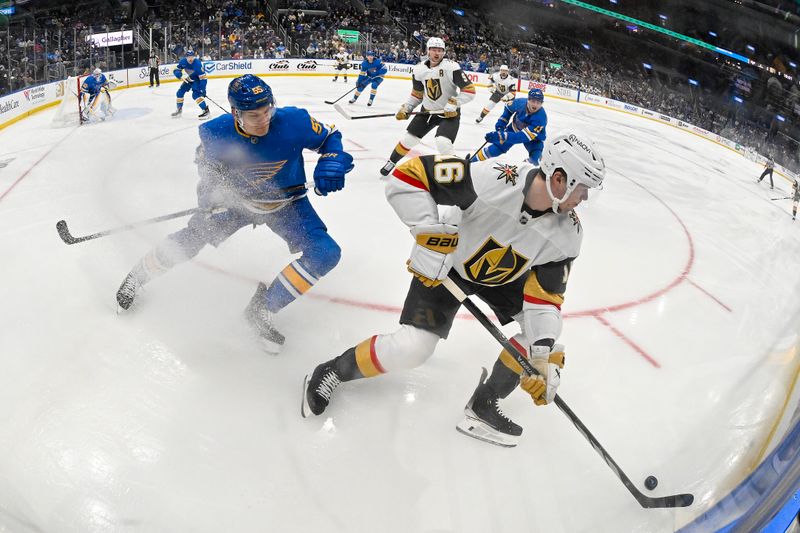 Jan 2, 2026; St. Louis, Missouri, USA; Vegas Golden Knights right wing Pavel Dorofeyev (16) controls the puck as St. Louis Blues defenseman Colton Parayko (55) defends during the first period at Enterprise Center. Mandatory Credit: Jeff Curry-Imagn Images
