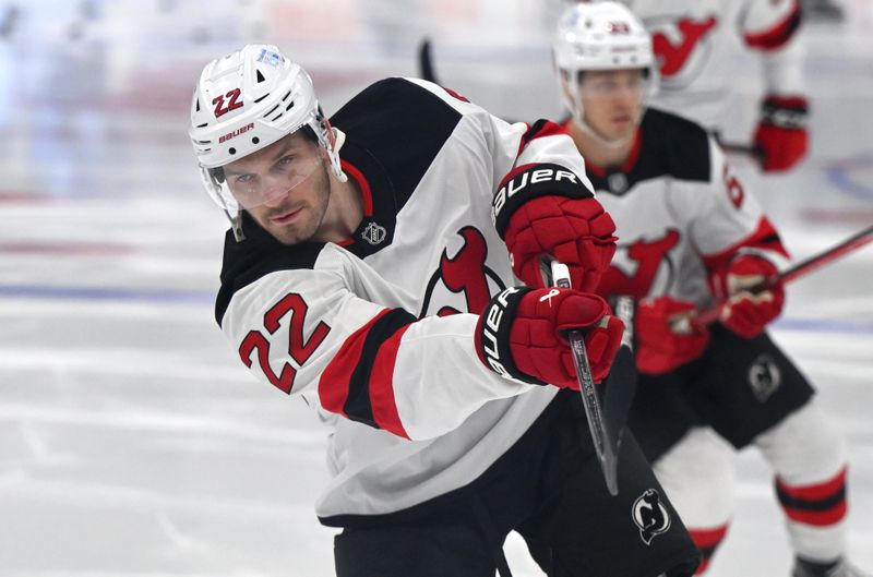 Jan 16, 2025; Toronto, Ontario, CAN;  New Jersey Devils defenseman Brett Pesce (22) warms up before playing the Toronto Maple Leafs at Scotiabank Arena. Mandatory Credit: Dan Hamilton-Imagn Images