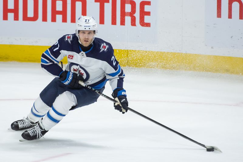 Jan 20, 2024; Ottawa, Ontario, CAN; Winnipeg Jets left wing Nikolaj Ehlers (27) skates with the puck in the third period against the Ottawa Senators at the Canadian Tire Centre. Mandatory Credit: Marc DesRosiers-USA TODAY Sports