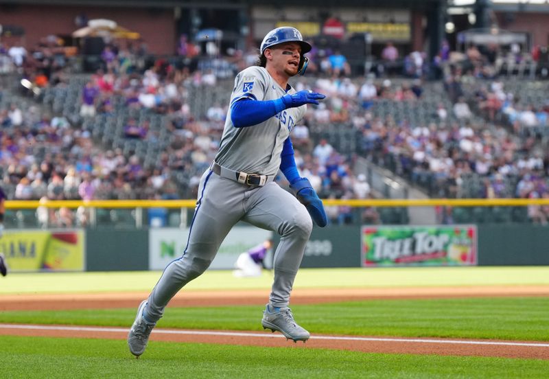 Jul 5, 2024; Denver, Colorado, USA; Kansas City Royals shortstop Bobby Witt Jr. (7) heads home to score a run in the first inning against the Colorado Rockies at Coors Field. Mandatory Credit: Ron Chenoy-USA TODAY Sports