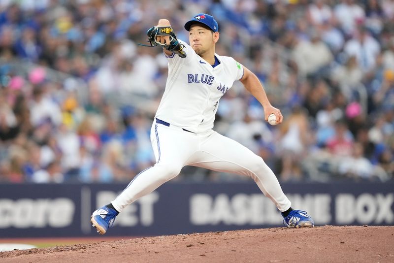 Jul 26, 2024; Toronto, Ontario, CAN; Toronto Blue Jays starting pitcher Yusei Kikuchi (16) pitches to the Texas Rangers during the third inning at Rogers Centre. Mandatory Credit: John E. Sokolowski-USA TODAY Sports