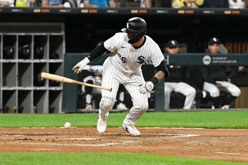 Jun 27, 2024; Chicago, Illinois, USA;  Chicago White Sox catcher Korey Lee (26) drops his bat while attempting to bunt against the Colorado Rockies during the third inning at Guaranteed Rate Field. Mandatory Credit: Matt Marton-USA TODAY Sports