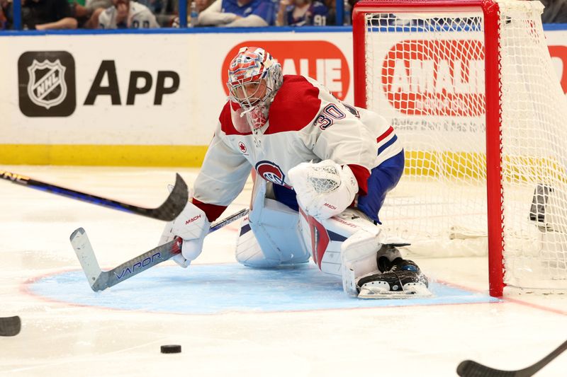 Mar 2, 2024; Tampa, Florida, USA;  Montreal Canadiens goaltender Cayden Primeau (30) defends the goal against the Tampa Bay Lightning during the third period at Amalie Arena. Mandatory Credit: Kim Klement Neitzel-USA TODAY Sports