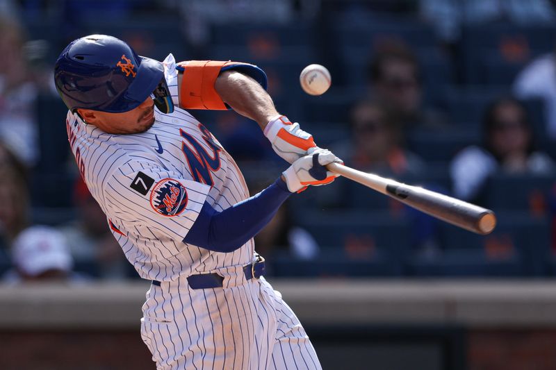 Apr 20, 2025; New York City, New York, USA; New York Mets right fielder Tyrone Taylor (15) hits an RBI double during the eighth inning against the St. Louis Cardinals at Citi Field. Mandatory Credit: Vincent Carchietta-Imagn Images