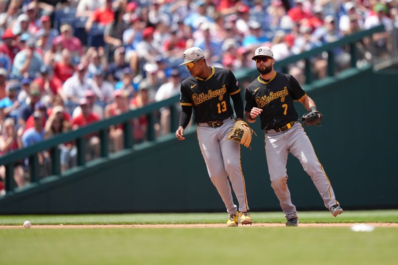 May 18, 2025; Philadelphia, Pennsylvania, USA; Pittsburgh Pirates infielder Ke'Bryan Hayes (13) allows an infield single after misplaying a ball against the Philadelphia Phillies in the fifth inning at Citizens Bank Park. Mandatory Credit: Kyle Ross-Imagn Images