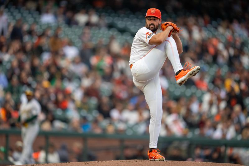 Jul 30, 2024; San Francisco, California, USA;  San Francisco Giants starting pitcher Robbie Ray (23) delivers a pitch against the Oakland Athletics during the first inning at Oracle Park. Mandatory Credit: Neville E. Guard-USA TODAY Sports