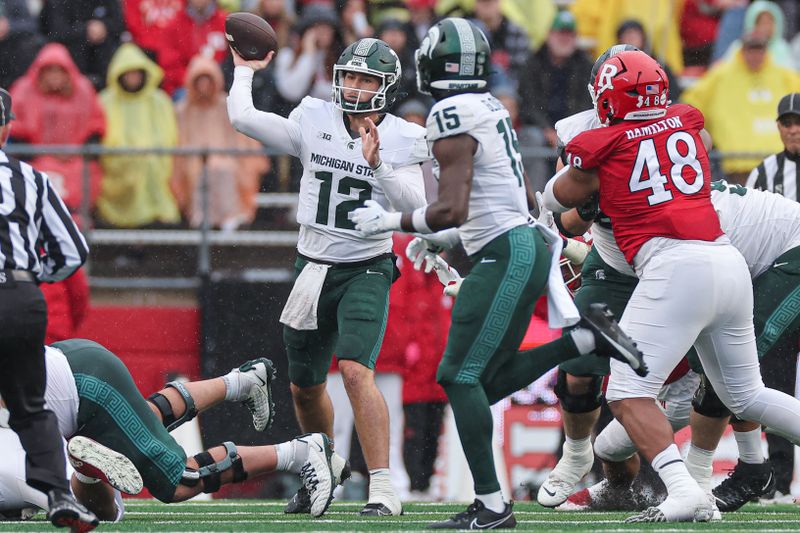 Oct 14, 2023; Piscataway, New Jersey, USA; Michigan State Spartans quarterback Katin Houser (12) throws the ball against the Rutgers Scarlet Knights during the first half at SHI Stadium. Mandatory Credit: Vincent Carchietta-USA TODAY Sports