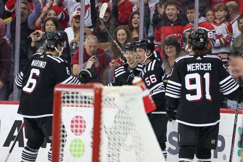 Oct 27, 2023; Newark, New Jersey, USA; New Jersey Devils left wing Erik Haula (56) celebrates his goal with teammates during the third period against the Buffalo Sabres at Prudential Center. Mandatory Credit: Vincent Carchietta-USA TODAY Sports