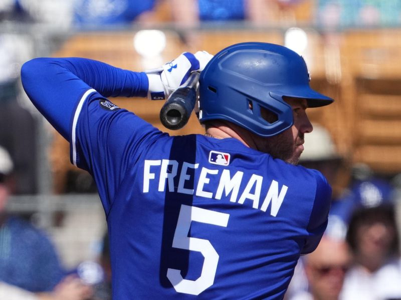 Mar 10, 2025; Phoenix, Arizona, USA; Los Angeles Dodgers first base Freddie Freeman (5) bats against the Arizona Diamondbacks during the first inning at Camelback Ranch-Glendale. Mandatory Credit: Joe Camporeale-Imagn Images