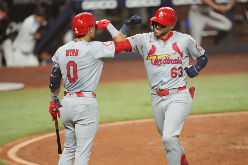 Jun 17, 2024; Miami, Florida, USA;  St. Louis Cardinals center fielder Michael Siani (63) celebrates a solo home run in the fifth inning against the Miami Marlins with shortstop Masyn Winn (0) at loanDepot Park. Mandatory Credit: Jim Rassol-USA TODAY Sports