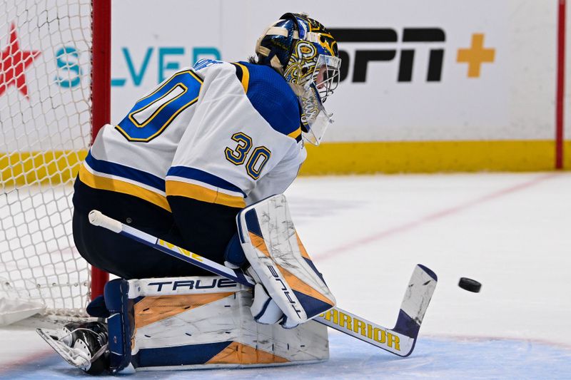 Mar 5, 2024; Elmont, New York, USA;  St. Louis Blues goaltender Joel Hofer (30) makes a save against the New York Islanders during the second period at UBS Arena. Mandatory Credit: Dennis Schneidler-USA TODAY Sports