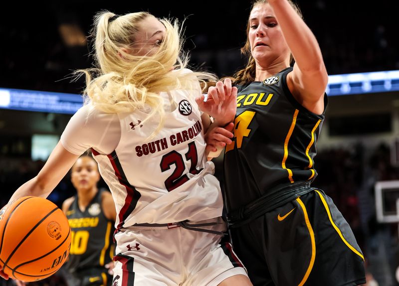 Jan 15, 2023; Columbia, South Carolina, USA; South Carolina Gamecocks forward Chloe Kitts (21) looks to get around Missouri Tigers guard Ashton Judd (24) in the second half at Colonial Life Arena. Mandatory Credit: Jeff Blake-USA TODAY Sports