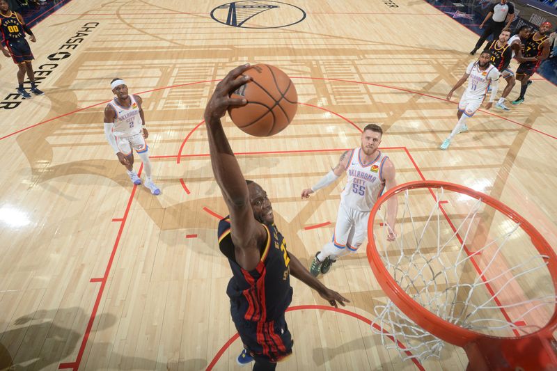 SAN FRANCISCO, CA - NOVEMBER 27: Draymond Green #23 of the Golden State Warriors dunks the ball during the game against the Oklahoma City Thunder on November 27, 2024 at Chase Center in San Francisco, California. NOTE TO USER: User expressly acknowledges and agrees that, by downloading and or using this photograph, user is consenting to the terms and conditions of Getty Images License Agreement. Mandatory Copyright Notice: Copyright 2024 NBAE (Photo by Noah Graham/NBAE via Getty Images)