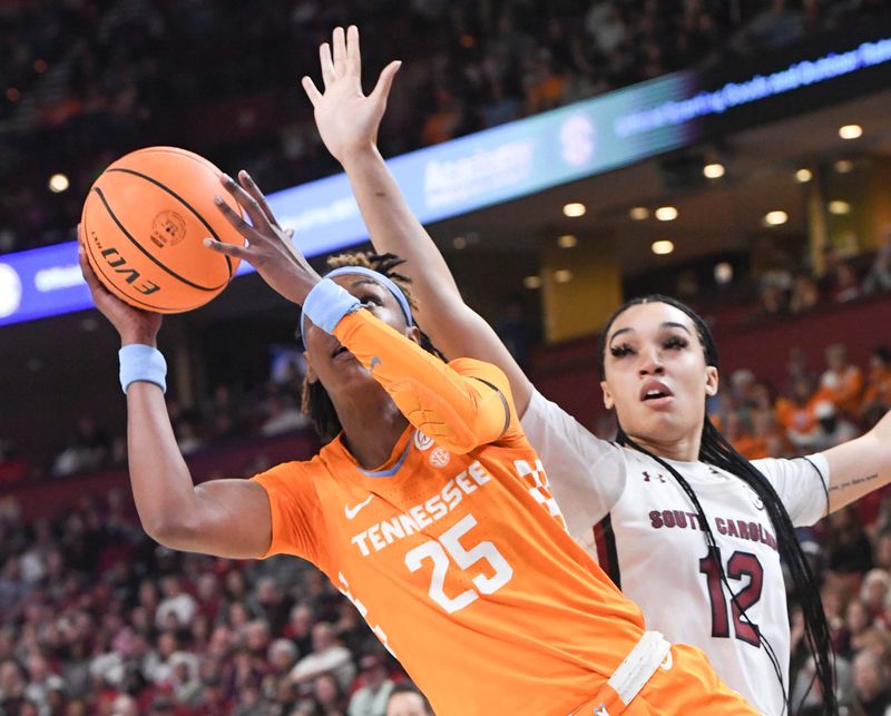 Mar 5, 2023; Greenville, SC, USA; Tennessee guard Jordan Horston (25) shoots past South Carolina guard Brea Beal (12) during the first quarter of the SEC Women's Basketball Tournament at Bon Secours Wellness Arena. Mandatory Credit: Ken Ruinard-USA TODAY Sports