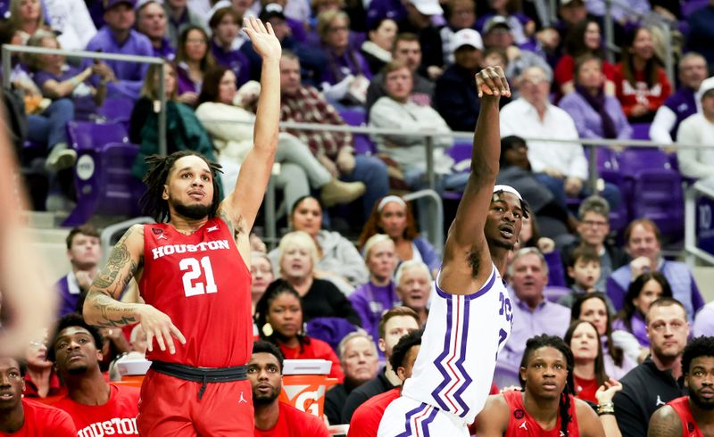 Jan 13, 2024; Fort Worth, Texas, USA;  TCU Horned Frogs forward Emanuel Miller (2) reacts after shooting in front of Houston Cougars guard Emanuel Sharp (21) during the first half at Ed and Rae Schollmaier Arena. Mandatory Credit: Kevin Jairaj-USA TODAY Sports