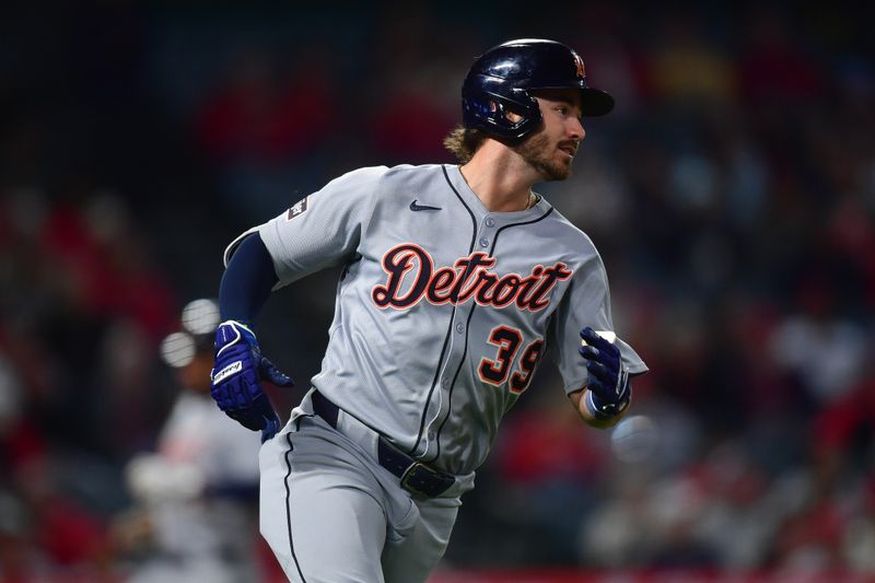 May 1, 2025; Anaheim, California, USA; Detroit Tigers left fielder Zach McKinstry (39) hits an RBI single against the Los Angeles Angels during the eighth inning at Angel Stadium. Mandatory Credit: Gary A. Vasquez-Imagn Images
