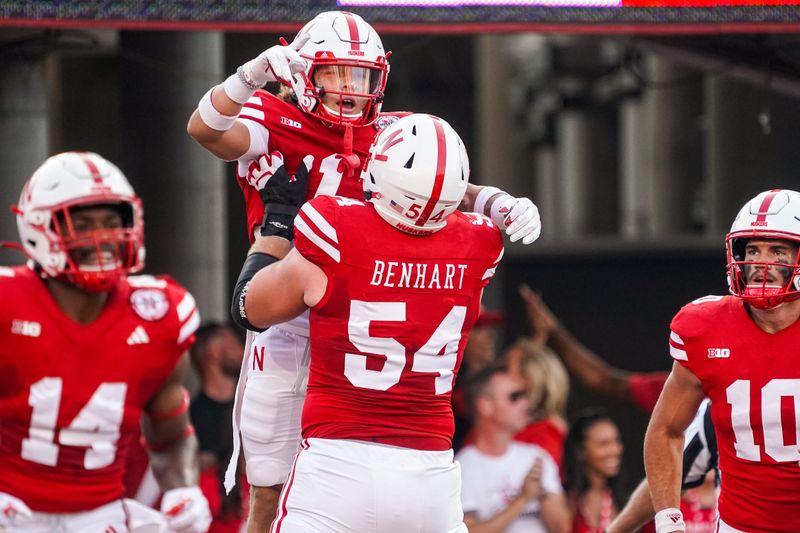 Sep 16, 2023; Lincoln, Nebraska, USA; Nebraska Cornhuskers wide receiver Billy Kemp IV (1) celebrates with offensive lineman Bryce Benhart (54) after scoring against the Northern Illinois Huskies during the first quarter at Memorial Stadium. Mandatory Credit: Dylan Widger-USA TODAY Sports