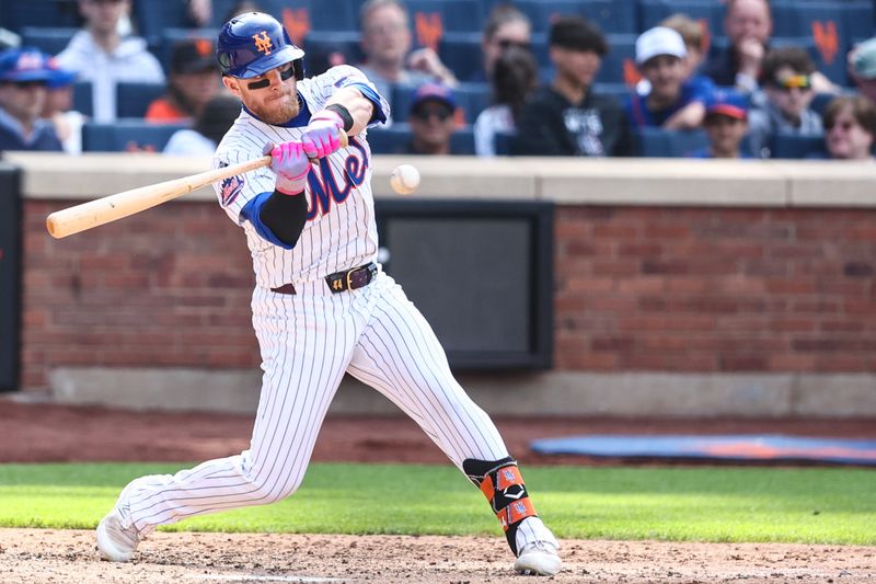 Apr 28, 2024; New York City, New York, USA; New York Mets center fielder Harrison Bader (44) hits a game tying RBI single in the 11th inning against the St. Louis Cardinals at Citi Field. Mandatory Credit: Wendell Cruz-USA TODAY Sports