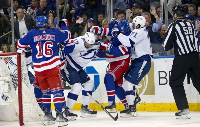 Apr 5, 2023; New York, New York, USA; Tampa Bay Lightning left wing Alex Killorn (17) and center Anthony Cirelli (71) fight with New York Rangers defenseman Ryan Lindgren (55) during the second period at Madison Square Garden. Mandatory Credit: Danny Wild-USA TODAY Sports