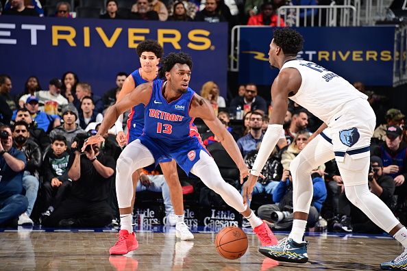 DETROIT, MI - DECEMBER 6: James Wiseman #13 of the Detroit Pistons plays defense during the game  against Jaren Jackson Jr. #13 of the Memphis Grizzlies on December 6, 2023 at Little Caesars Arena in Detroit, Michigan. NOTE TO USER: User expressly acknowledges and agrees that, by downloading and/or using this photograph, User is consenting to the terms and conditions of the Getty Images License Agreement. Mandatory Copyright Notice: Copyright 2023 NBAE (Photo by Chris Schwegler/NBAE via Getty Images)