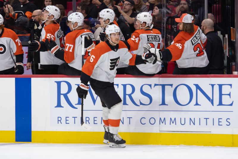 Nov 14, 2024; Ottawa, Ontario, CAN; Philadelphia Flyers defenseman Travis Sanheim (6) celebrates with team his goal scored in the first period against the Ottawa Senators at the Canadian Tire Centre. Mandatory Credit: Marc DesRosiers-Imagn Images