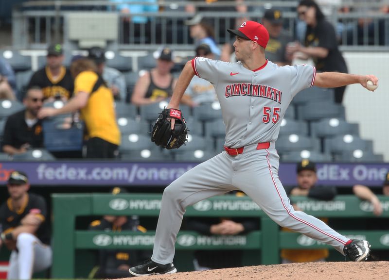May 21, 2025; Pittsburgh, Pennsylvania, USA;  Cincinnati Reds relief pitcher Taylor Rogers (55) pitches against the Pittsburgh Pirates during the sixth inning at PNC Park. Mandatory Credit: Charles LeClaire-Imagn Images