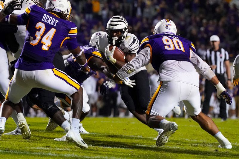 Oct 15, 2022; Greenville, North Carolina, USA;  Memphis Tigers running back Asa Martin (28) runs with the ball against the East Carolina Pirates during the overtime at Dowdy-Ficklen Stadium. Mandatory Credit: James Guillory-USA TODAY Sports