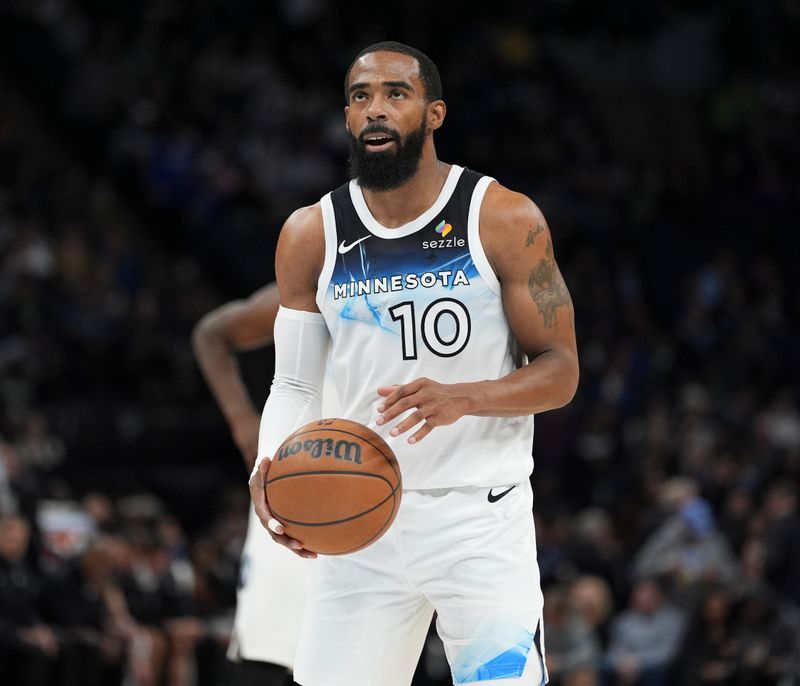 MINNEAPOLIS, MN -  NOVEMBER 27:  Mike Conley #10 of the Minnesota Timberwolves shoots a free throw during the game against the Sacramento Kings on November 27, 2024 at Target Center in Minneapolis, Minnesota. NOTE TO USER: User expressly acknowledges and agrees that, by downloading and or using this Photograph, user is consenting to the terms and conditions of the Getty Images License Agreement. Mandatory Copyright Notice: Copyright 2024 NBAE (Photo by Jordan Johnson/NBAE via Getty Images)