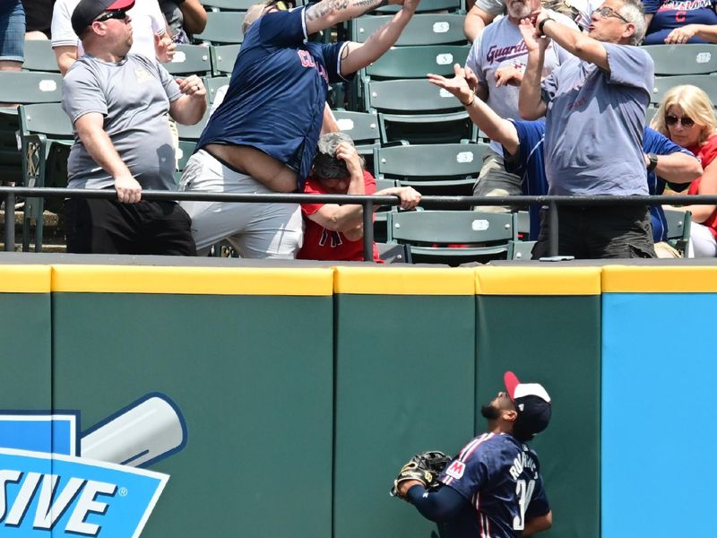 May 22, 2024; Cleveland, Ohio, USA; Cleveland Guardians right fielder Johnathan Rodriguez (30) watches as fans try to catch a home run hit by New York Mets first baseman Pete Alonso (not pictured) during the first inning at Progressive Field. Mandatory Credit: Ken Blaze-USA TODAY Sports
