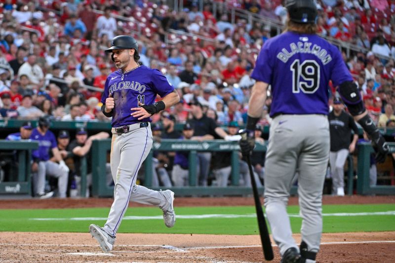 Jun 6, 2024; St. Louis, Missouri, USA;  Colorado Rockies left fielder Jake Cave (11) scores on a wild pitch by St. Louis Cardinals starting pitcher Sonny Gray (not pictured) during the fifth inning at Busch Stadium. Mandatory Credit: Jeff Curry-USA TODAY Sports