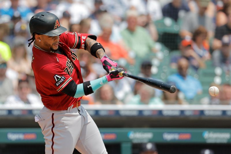 Jun 10, 2023; Detroit, Michigan, USA;  Arizona Diamondbacks second baseman Ketel Marte (4) hits a single in the second inning against the Detroit Tigers at Comerica Park. Mandatory Credit: Rick Osentoski-USA TODAY Sports