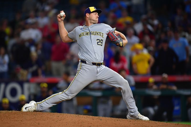 Jun 18, 2024; Anaheim, California, USA; Milwaukee Brewers pitcher Trevor Megill (29) throws against the Los Angeles Angels during the ninth inning at Angel Stadium. Mandatory Credit: Gary A. Vasquez-USA TODAY Sports