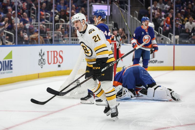 Nov 26, 2025; Elmont, New York, USA; Boston Bruins center Alex Steeves (21) celebrates after scoring goal in the first period at UBS Arena. Mandatory Credit: Wendell Cruz-Imagn Images